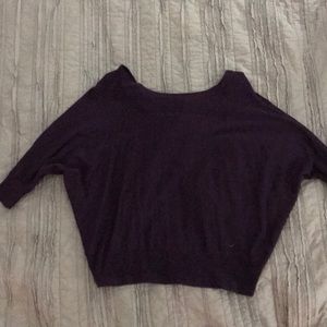Cute sweater with open back .